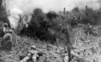 Marines await result of a 
blasting charge, prepared to pick off any Japanese who might attempt escape