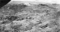 Oboe hill mass was under 
attack by the 77th Division artillery when this picture was taken 23 May