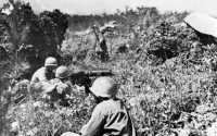 On top of Yaeju-Dake 18 
June, 96th Division infantrymen (below) probe hidden enemy pockets