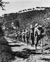 Infantrymen in full field 
equipment advancing toward the Gothic Line on 10 September 1944