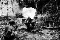 Attacking a Japanese bunker 
with an M1A1 portable flame thrower, Bougainville, March 1944