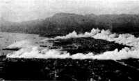 Smoke screen demonstration 
over the harbor, Palermo, Sicily