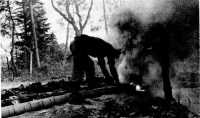 small M1 smoke pots set off 
in a series to maintain a screen for troops in the Gothic Line, Italy