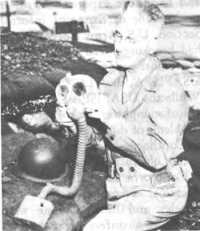 Colonel Marriott examining 
Japanese gas mask