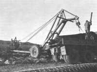 Tractor-operated LeTourneau 
crane M20 used by engineers to unload pierced steel plank at an airfield in North Africa, January 1943