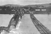 Steel treadway bridge from 
Simbach, Germany, to Braunau, Austria, replaces the one destroyed by retreating Germans, May 1945