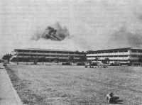 3,200-man barracks burning 
after Japanese attack, Hickam Field, Hawaii, 7 December 1941