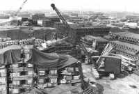 Engineer crane stacks 
lumber at Thatcham, April 1944
