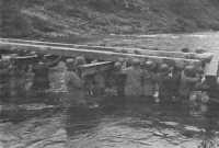 Seventh Army engineers 
install a bridge on the Ill river