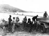 The Port Moresby causeway, 
looking toward Tatana Island (General Johns in the foreground, third from left)