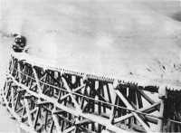 A pipeline carried on a 
Whitehorse and Yukon Railroad trestle