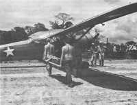 Loading a sick soldier onto 
a small plane in Darien Province, Panama, far evacuation to one of the Canal Zone hospitals