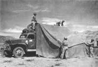 Setting up a tent over a 
mobile surgical truck in Tunisia