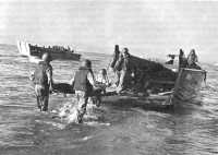 Litter bearers wading to 
landing craft off Salerno, 9 September