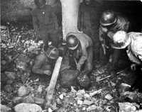 Wounded man being dug from 
debris near Cassino