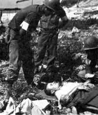Medics giving first aid on 
invasion beach, 15 August