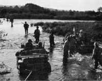 Jeep ambulance bringing 
wounded back across the Moselle