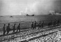 Carrying D-day wounded to 
the beach for trip by LST to Corsica