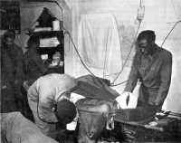 Treating a wounded soldier 
in a 317th Medical Battalion collecting station near Massa, February 1945