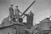 Heavy Tank M6, mounting a 
3-inch gun, produced by Baldwin Locomotive Works, is inspected by (from left) Lt
