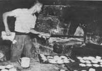 Quartermaster corps baker 
on Bataan baking biscuits for the defenders, 4 February 1942