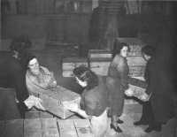 British women war workers 
unloading American supplies at Thatcham Depot, October 1942